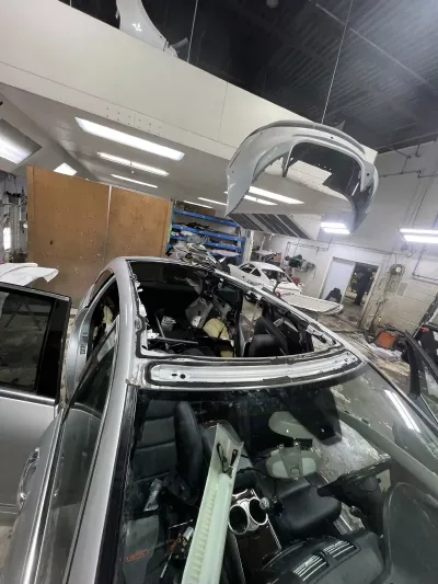 Panoramic glass roof replacement on luxury vehicle